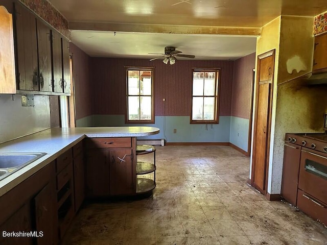 425 Barbour St, North Adams, MA 01247 - kitchen featuring a peninsula, range, a ceiling fan, and light countertops