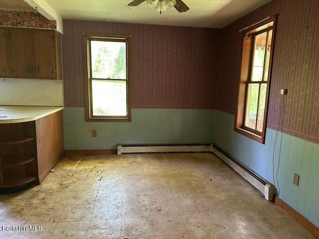425 Barbour St, North Adams, MA 01247 - unfurnished dining area featuring ceiling fan, a baseboard radiator, and light flooring