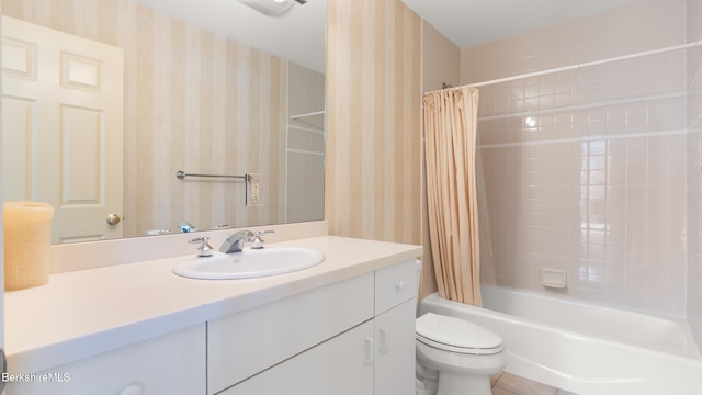 bathroom featuring shower / tub combo with curtain, vanity, toilet, and wallpapered walls