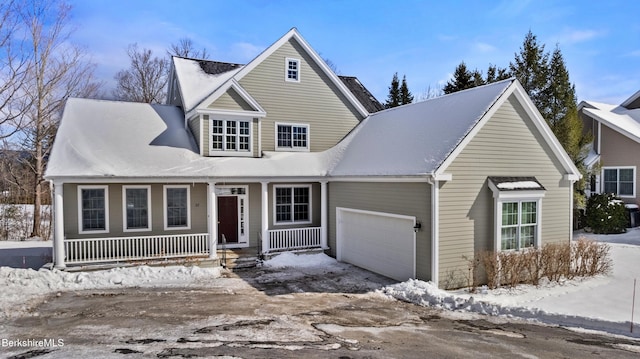 view of front of house featuring a garage and covered porch