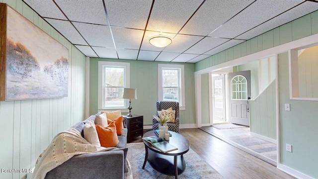 208 Columbia St, Adams, MA 01220 - living area with a drop ceiling, wood finished floors, and baseboards