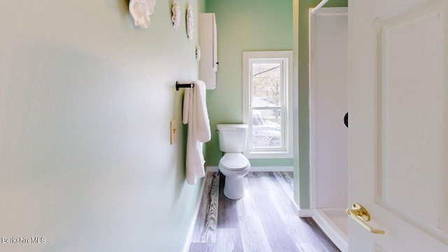 208 Columbia St, Adams, MA 01220 - full bath with baseboards, wood finished floors, toilet, and a shower