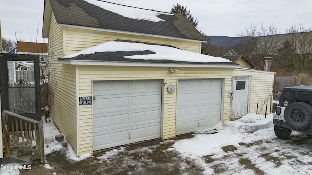 view of snow covered garage