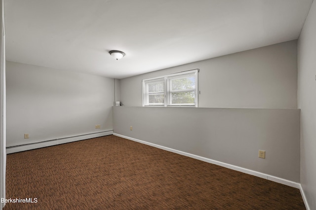 881 Holmes Rd, Pittsfield, MA 01201 - empty room featuring a baseboard heating unit and baseboards