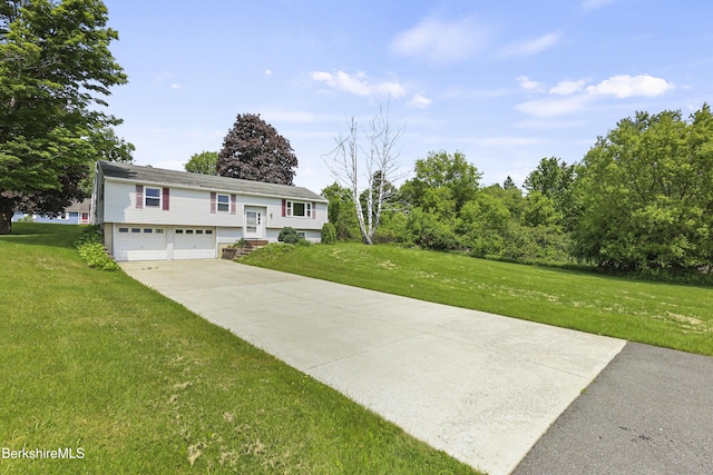 881 Holmes Rd, Pittsfield, MA 01201 - raised ranch with an attached garage, a front lawn, and driveway