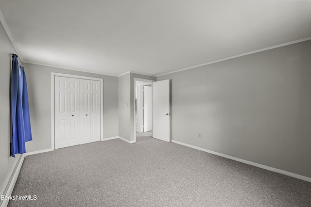 881 Holmes Rd, Pittsfield, MA 01201 - unfurnished bedroom featuring crown molding, carpet, baseboards, and a closet