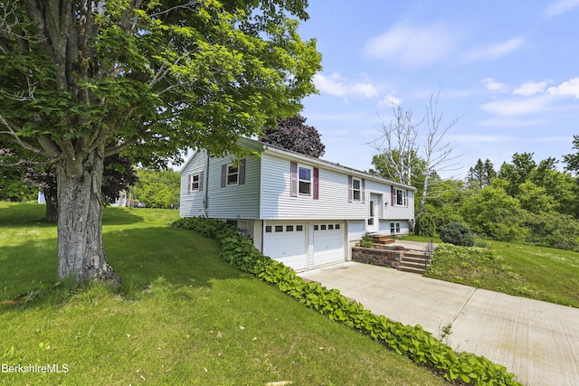 881 Holmes Rd, Pittsfield, MA 01201 - bi-level home with a garage, a front yard, and driveway
