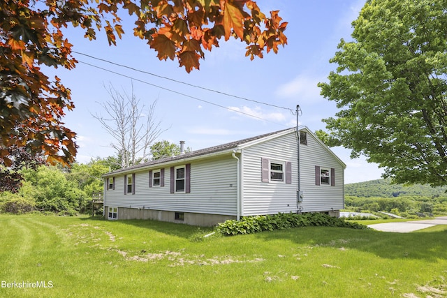 881 Holmes Rd, Pittsfield, MA 01201 - view of home's exterior with a lawn