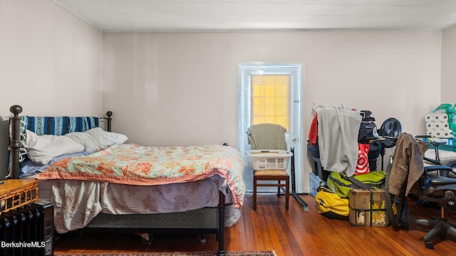 bedroom with hardwood / wood-style floors