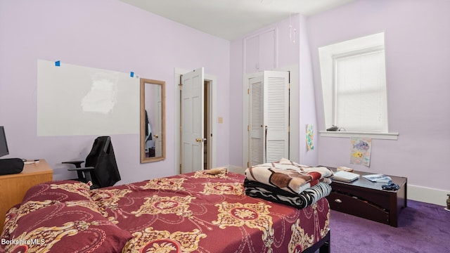 bedroom with a closet and carpet flooring