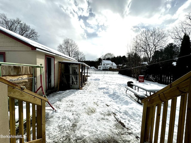 view of yard layered in snow