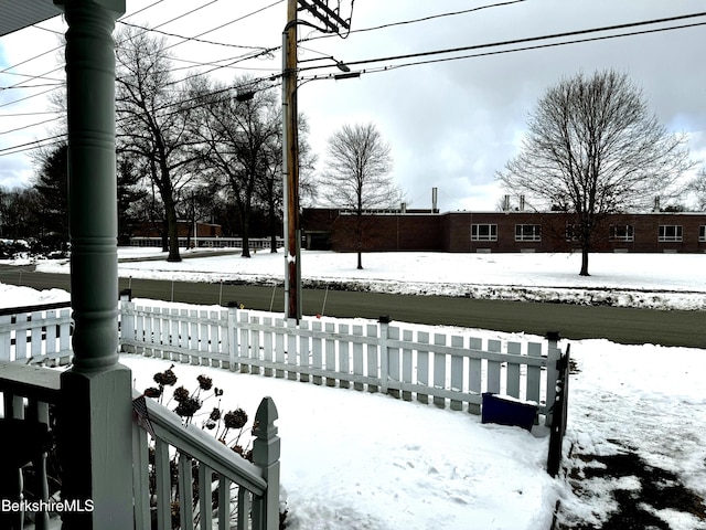 view of yard layered in snow