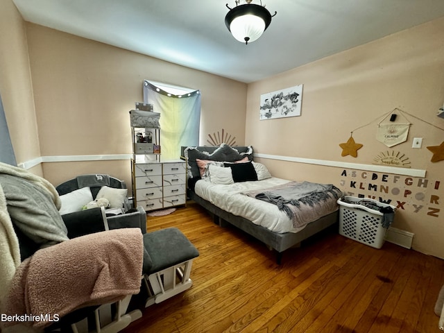 bedroom featuring wood-type flooring