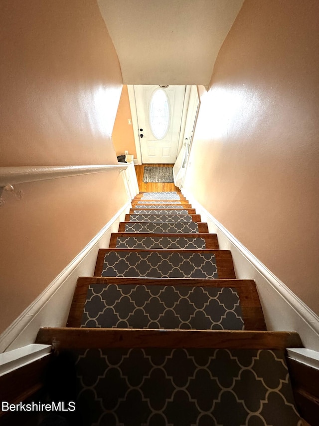 staircase featuring hardwood / wood-style floors