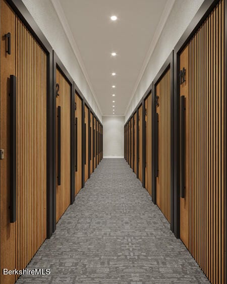 corridor featuring carpet floors and crown molding