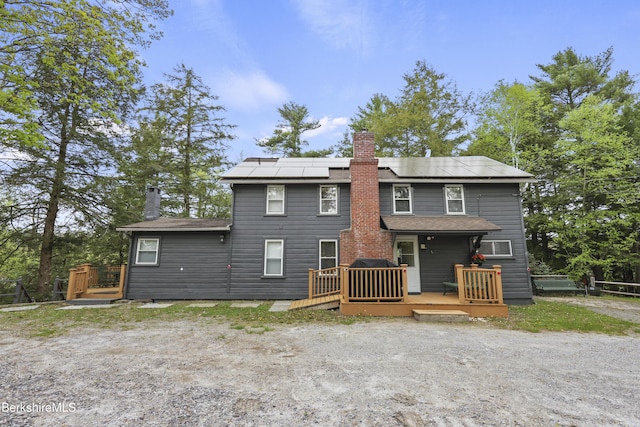 123 Bock Way, New Marlborough, MA 01230 - rear view of house with a chimney, a deck, and solar panels