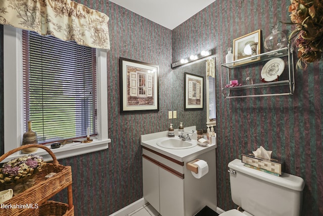 770 Summer St Unit 3A, Lee, MA 01238 - half bath featuring vanity, toilet, wallpapered walls, baseboards, and tile patterned flooring
