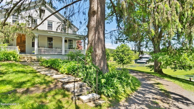 view of side of home featuring a porch