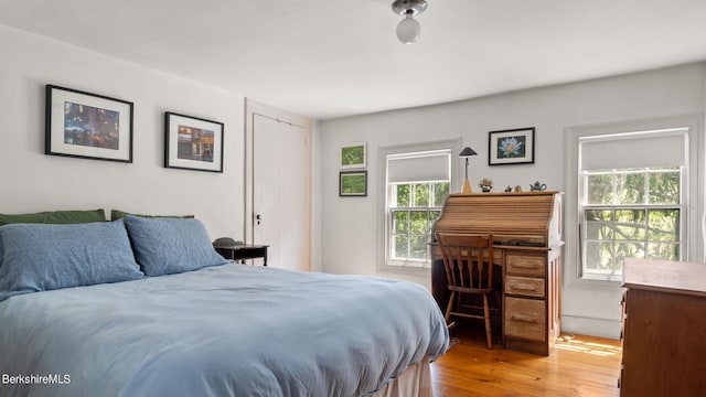 bedroom with hardwood / wood-style flooring