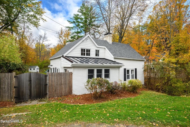 view of property exterior featuring a yard