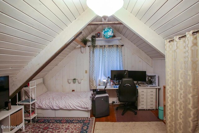 bedroom featuring vaulted ceiling with beams, wood ceiling, wood finished floors, and wooden walls