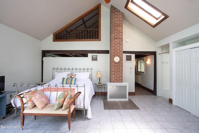 311 N Plain Rd, Great Barrington, MA 01236 - bedroom featuring high vaulted ceiling, a skylight, tile patterned floors, and a closet