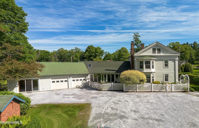 311 N Plain Rd, Great Barrington, MA 01236 - view of front facade featuring a chimney, a garage, and driveway