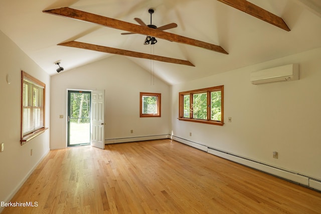 spare room with an AC wall unit, ceiling fan, a baseboard radiator, beamed ceiling, and light hardwood / wood-style floors