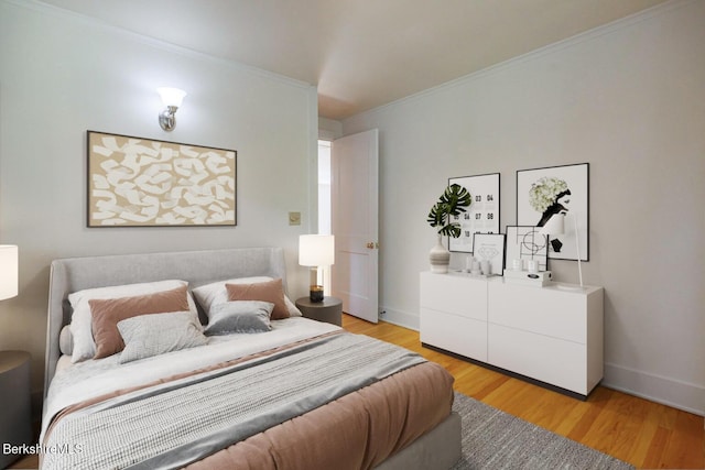 bedroom featuring light hardwood / wood-style floors and ornamental molding