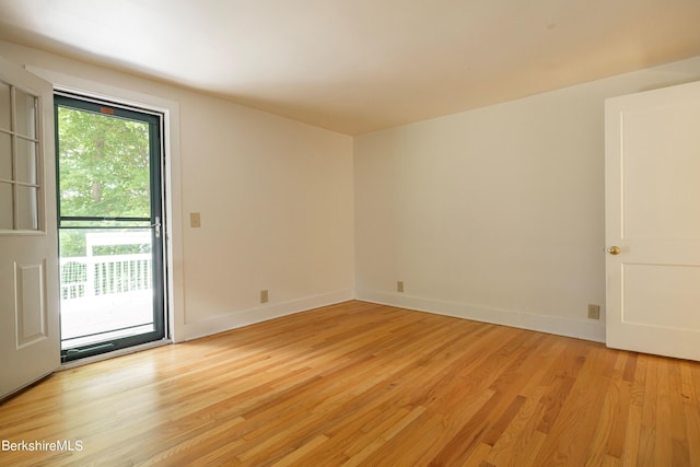 empty room with light hardwood / wood-style floors