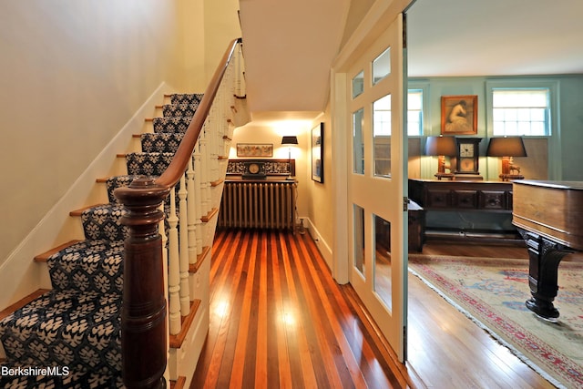 49 Main St, Stockbridge, MA 01262 - staircase with radiator heating unit and wood finished floors