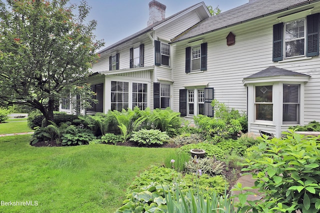 49 Main St, Stockbridge, MA 01262 - view of property exterior with a chimney, a lawn, and a shingled roof