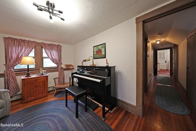 49 Main St, Stockbridge, MA 01262 - living area featuring wood finished floors, a baseboard heating unit, and a chandelier