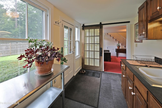 49 Main St, Stockbridge, MA 01262 - doorway featuring stairway, a barn door, and dark tile patterned floors