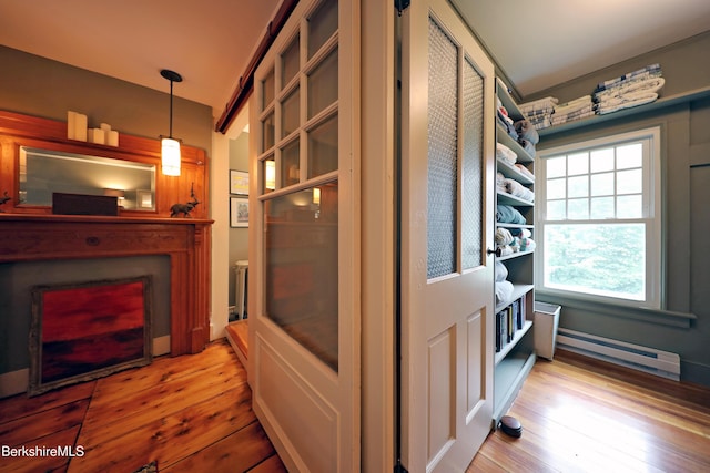49 Main St, Stockbridge, MA 01262 - corridor featuring baseboard heating and light wood finished floors