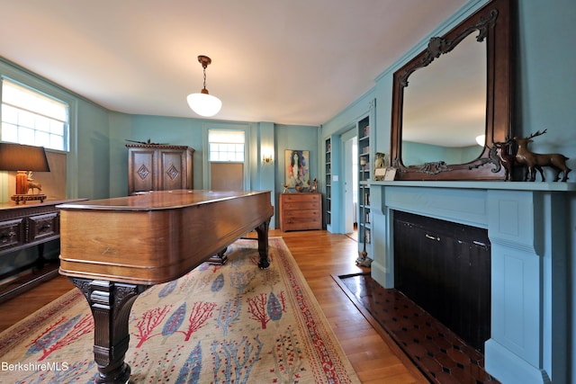 49 Main St, Stockbridge, MA 01262 - bedroom featuring wood finished floors and a fireplace with flush hearth