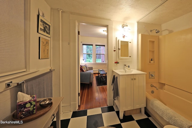 49 Main St, Stockbridge, MA 01262 - bathroom with tile patterned floors, shower / washtub combination, vanity, and a textured ceiling