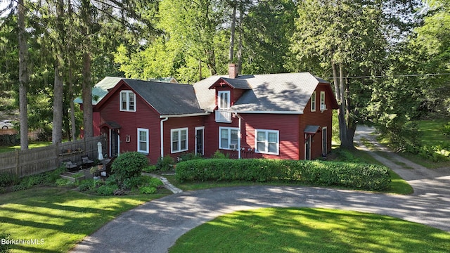 49 Main St, Stockbridge, MA 01262 - view of front of property featuring driveway, a chimney, and view of wooded area
