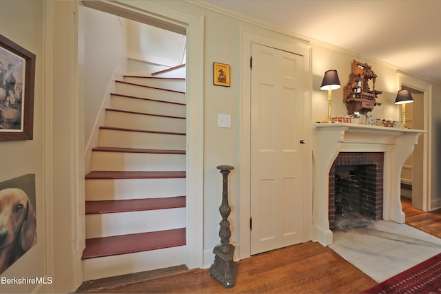 49 Main St, Stockbridge, MA 01262 - stairs with wood finished floors and a brick fireplace