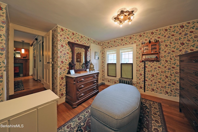 49 Main St, Stockbridge, MA 01262 - living area featuring wood finished floors, wallpapered walls, and a fireplace
