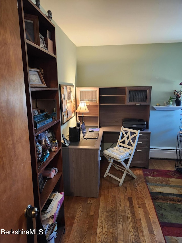 office area with a baseboard radiator and dark wood-style floors