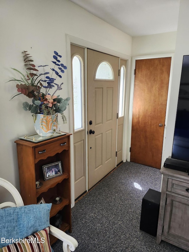 view of carpeted entrance foyer