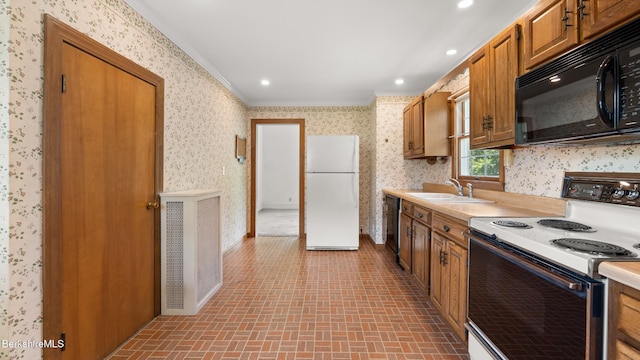 50 Harding St, Pittsfield, MA 01201 - kitchen with black appliances, wallpapered walls, light countertops, crown molding, and brown cabinetry