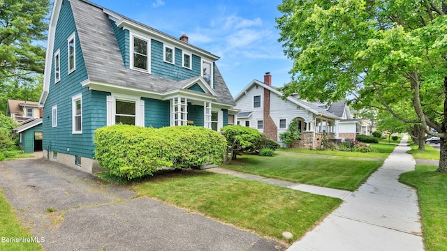 50 Harding St, Pittsfield, MA 01201 - view of front of property featuring a gambrel roof, a chimney, and a front yard