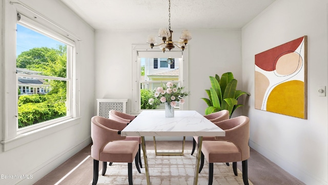 50 Harding St, Pittsfield, MA 01201 - dining room with a chandelier, light colored carpet, and a textured ceiling