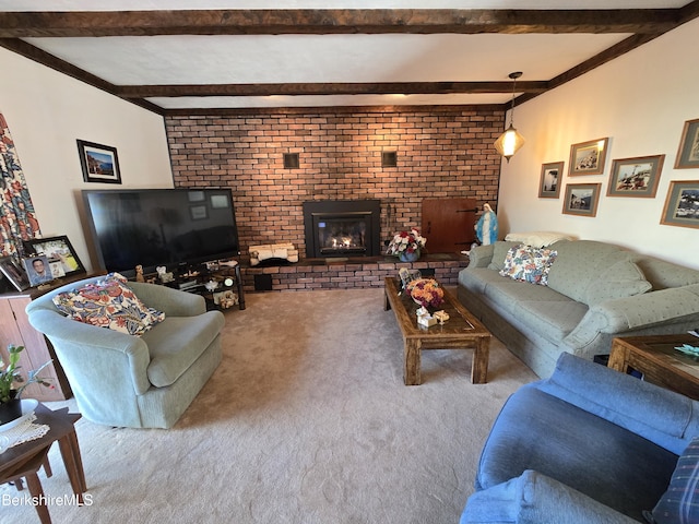 living room featuring light carpet, a fireplace, and beam ceiling