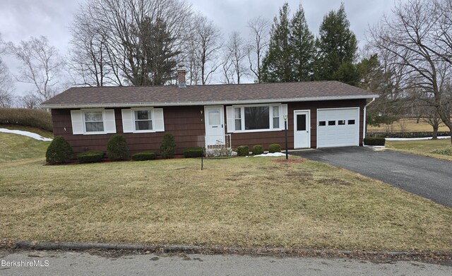 ranch-style house featuring a garage