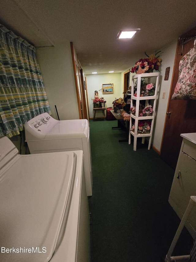 laundry area featuring washer and clothes dryer and carpet