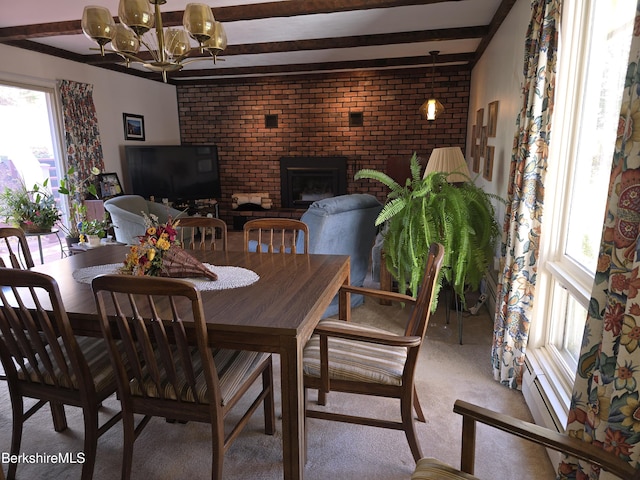 carpeted dining area featuring beam ceiling, a fireplace, brick wall, and an inviting chandelier