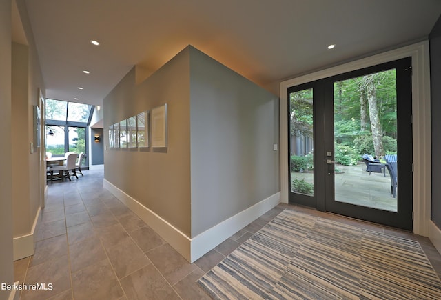 interior space featuring tile patterned floors and a wall of windows